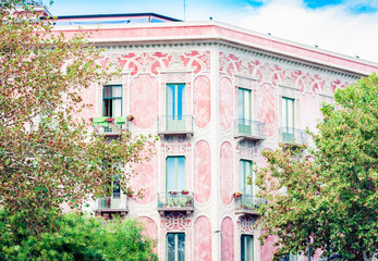 Traditional architecture of Sicily in Italy, typical street of Catania, facade of old house.