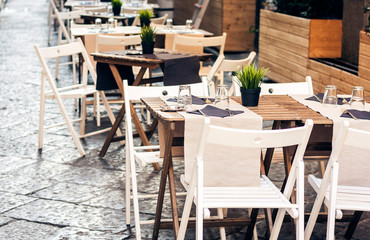 Serving on the table on terrace in the restaurant in Catania, Sicily, Italy, setting for diner.