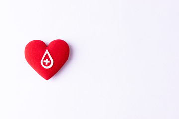 Woman hand holding red heart for blood donation,world blood donor day. Copy space for advertisers.