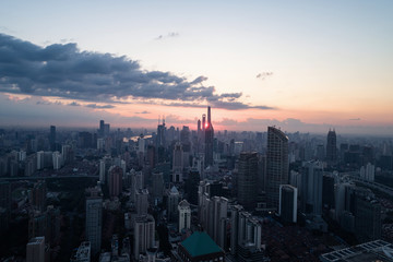 Fototapeta premium Aerial view of business area and cityscape in the dawn, West Nanjing Road, Jing` an district, Shanghai