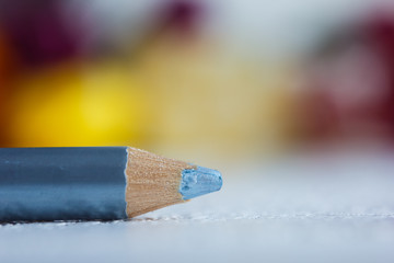 cosmetic pencil for applying makeup on the face close-up. eye liner in macro on blurred background