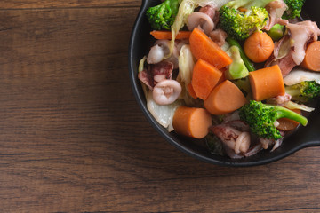 Stir fried broccoli with Squid and Sausage.