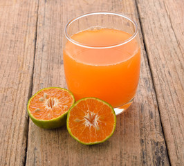 orange juice on wooden background