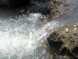 river water flow with large rocks