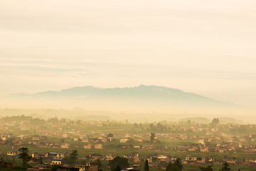 Obraz premium Misty peaks and villages in the morning, in southwestern China.