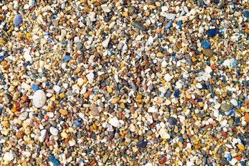 Colorful small pebbles or stone in sea with difference color.