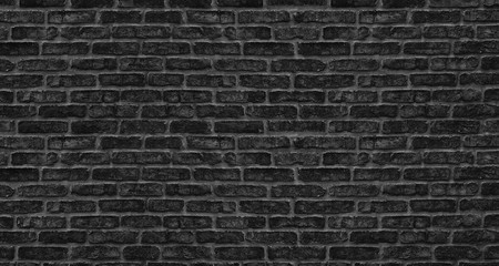 Plakat Black brick wall texture. Old rough brickwork. Dark grunge background
