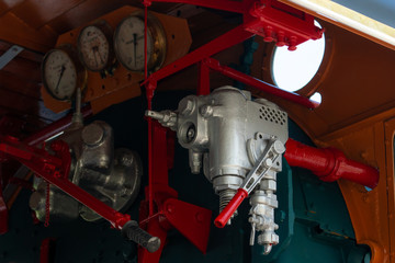 Closeup control valve of steam locomotive. Directional valves allow steam to flow through the steam locomotive engine drive system. Railway transportation industry. The train operated on furnace oil.