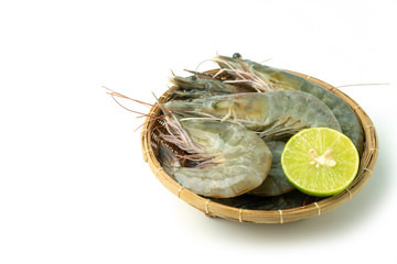 close up group of fresh raw pacific white shrimp and lemon in bamboo bowl on white background (Isolate background).