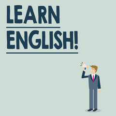 Conceptual hand writing showing Learn English. Concept meaning gain or acquire knowledge of speaking and writing English Businessman Looking Up, Holding and Talking on Megaphone