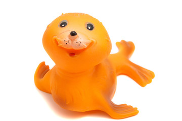 smiling seal toy on a white background