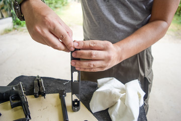 man cleaning gun
