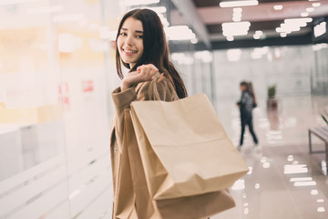 Beautiful fashionable woman with shopping bags.