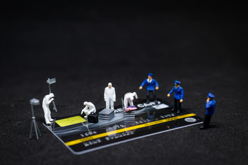 Miniature people : Police And Detective finding proof from credit card in crime scene, Cyber crime...
