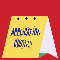 Writing note showing Application Coding. Business concept for process by which a mobile app is developed for mobile Modern fresh design of calendar using hard paper material