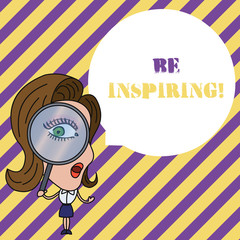 Fototapeta premium Writing note showing Be Inspiring. Business concept for Having the effect of motivating someone Being amazing Woman Looking Trough Magnifying Glass Big Eye Blank Round Speech Bubble