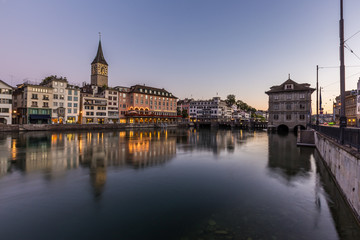 Beautiful view of old town zurich by limmat river before sunrise - obrazy, fototapety, plakaty
