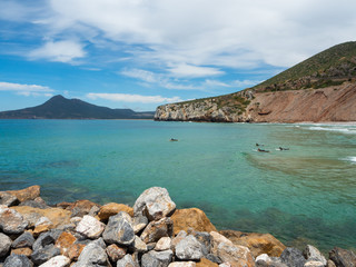 Fototapeta premium Some surfers in the beach of Buggerro in Sardinia