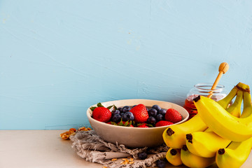 Variety of fruits, nuts, honey