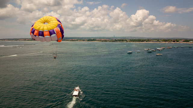 parachute riding with boat sea view Bali Indonesia
