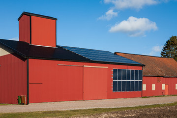 A farm in Sweden has added solar panels to the roof and wall of a barn building as a source of electricity.