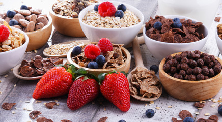 Bowls with different sorts of breakfast cereal products
