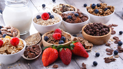 Bowls with different sorts of breakfast cereal products