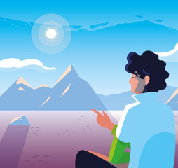 man seated observing snowscape nature