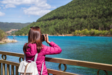 Fototapeta na wymiar Young woman traveler looking beautiful nature at blue moon valley in China, Travel lifestyle concept