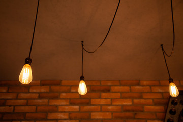Light bulbs on brick wall