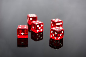 Red dice on transparent black background