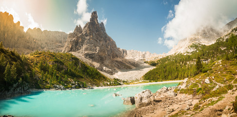 Lake Lago di Sorapis, Dolomites, Italy with blue sky, azure water and high mountains in the background