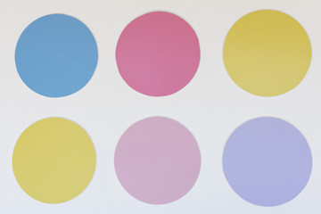 Set of multicolor circle shape on a white wall background.