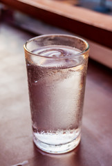 Glass water drink with tube blurred background