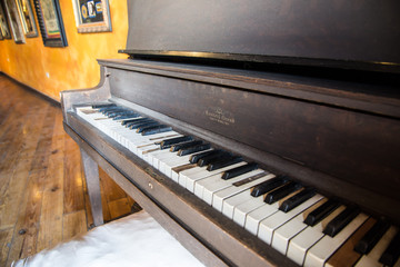 Fototapeta na wymiar Vintage piano with broken keys