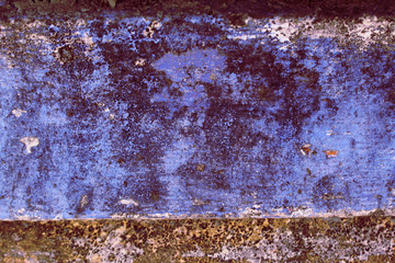 Fototapeta premium Dirty blue wall with black and white spots.