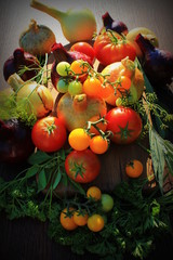 Healthy food ingredients background. Vegetables, herbs and spices. Organic vegetables on wood