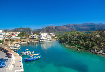 Fototapeta na wymiar A nice spring view of the old harbor of traditional village Sisi, Crete, Greece