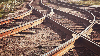 A railway track litted by the sun, toned.