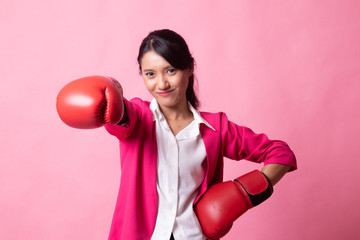 Young Asian woman with red boxing gloves.