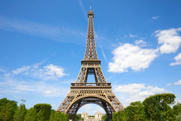 Fototapeta na wymiar Eiffel Tower in Paris in a sunny summer day, blue sky in France