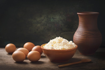 still life with bowl of cottage cheese and brown eggs