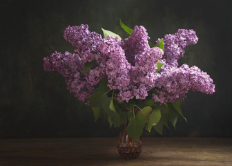 still life with blooming branches of lilac flowers