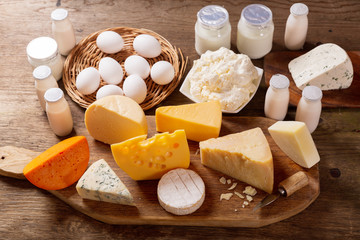 various types of dairy products on rustic wooden table