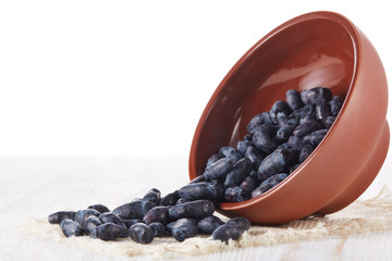 Ripe honeysuckles in a bowl.