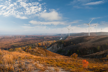Wind electric turbines on hills