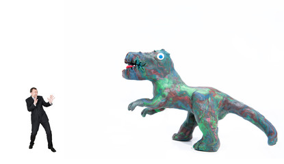 Business person afraid of a big dinosaur. Abstract photo.