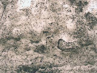 Snow on artifical football field with rubber scales