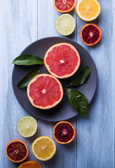 citrus fruits slice top view wood background.