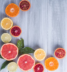 citrus fruits slice top view wood background.